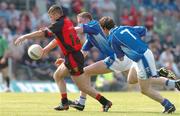 16 May 2004; Ronan Sexton, Down, in action against Pearse McKenna and Anthony Gaynor, 7, Cavan. Bank of Ireland Ulster Senior Football Championship, Down v Cavan, Casement Park, Belfast. Picture credit; David Maher / SPORTSFILE