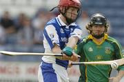 16 May 2004; James Young, Laois, scores a goal despite the attentions of Meath's Pat Roche. Guinness Leinster Senior Hurling Championship, Laois v Meath, O'Moore Park, Portlaoise, Co Laois. Picture credit; Matt Browne / SPORTSFILE