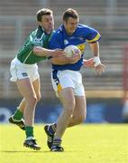 16 May 2004; Fergal O'Callaghan, Tipperary, is tackled by Mike O'Brien, Limerick. Bank of Ireland Munster Senior Football Championship, Tipperary v Limerick, Pairc Ui Chaoimh, Cork. Picture credit; Brendan Moran / SPORTSFILE