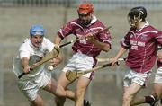 16 May 2004; Andy Quinn, Kildare, in action against Brian Connaughton, left, and Ronan Whelan, Westmeath. Guinness Leinster Senior Hurling Championship, Westmeath v Kildare, Cusack Park, Mullingar, Co. Westmeath. Picture credit; Pat Murphy / SPORTSFILE