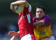 16 May 2004; David Devaney, Louth, in action against John Hegarty, Wexford. Bank of Ireland Leinster Senior Football Championship, Wexford v Louth, Parnell Park, Dublin. Picture credit; Brian Lawless / SPORTSFILE