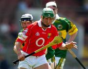 16 May 2004; Jonathan O'Callaghan, Cork, in action against Colin Harris, Kerry. Guinness Munster Senior Hurling Championship, Cork v Kerry, Pairc Ui Chaoimh, Cork. Picture credit; Brendan Moran / SPORTSFILE