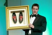 19 May 2004; Irish rugby International Ronan O'Gara with the boots he wore during the Six Nations Championship and Triple Crown games during the auction at the O2 Irish Rugby Union Players Association Awards at the Burlington Hotel, Dublin. Picture credit; Brendan Moran / SPORTSFILE