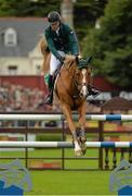 9 August 2013; Conor Swail, Ireland, competing on Lansdowne, on the way to completing a clear round during the Furusiyya FEI Nations Cup. Discover Ireland Dublin Horse Show 2013, RDS, Ballsbridge, Dublin. Picture credit: Barry Cregg / SPORTSFILE
