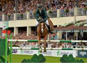 9 August 2013; Conor Swail, Ireland, competing on Lansdowne, on the way to completing a clear round during the Furusiyya FEI Nations Cup. Discover Ireland Dublin Horse Show 2013, RDS, Ballsbridge, Dublin. Picture credit: Barry Cregg / SPORTSFILE