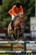 9 August 2013; Albert Voorn, Netherlands, competing on Tobalio, during the Furusiyya FEI Nations Cup. Discover Ireland Dublin Horse Show 2013, RDS, Ballsbridge, Dublin. Picture credit: Barry Cregg / SPORTSFILE
