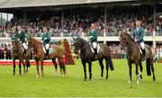 9 August 2013; The Ireland team, from left, Cian O'Connor, on Blue Loyd 12, Conor Swail, on Lansdowne, Shane Breen, on Balloon, and Dermott Lennon, on Loughview Lou-Lou, during the National Anthem ahead of the Furusiyya FEI Nations Cup. Discover Ireland Dublin Horse Show 2013, RDS, Ballsbridge, Dublin. Picture credit: Barry Cregg / SPORTSFILE