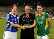 10 August 2013; Laois captain Maggie Murphy, left, and Meath captain Katie O'Brien shake hands in front of referee Michael O'Keeffe before the game. TG4 All-Ireland Ladies Football Senior Championship, Round 2, Qualifier, Laois v Meath, St. Brendan’s Park, Birr, Co. Offaly. Photo by Sportsfile