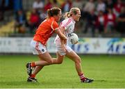 10 August 2013; Nollaig Cleary, Cork, in action against Niamh Henderson, Armagh. TG4 All-Ireland Ladies Football Senior Championship, Round 2, Qualifier, Armagh v Cork, St. Brendan’s Park, Birr, Co. Offaly. Photo by Sportsfile