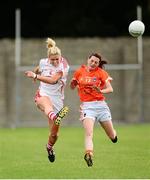 10 August 2013; Angela Walsh, Cork, in action against Mairead Tennyson, Armagh. TG4 All-Ireland Ladies Football Senior Championship, Round 2, Qualifier, Armagh v Cork, St. Brendan’s Park, Birr, Co. Offaly. Photo by Sportsfile