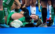 6 July 2022; Sarah Torrans of Ireland awaits medical attention for an injury during the FIH Women's Hockey World Cup Pool A match between Ireland and Germany at Wagener Stadium in Amstelveen, Netherlands. Photo by Jeroen Meuwsen/Sportsfile
