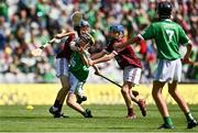 3 July 2022; Eoin Mangan, Abbeydorney NS, Kerry, representing Limerick, in action against Niall Kane, Scoil Éanna, Bullaun, Loughrea, Galway, representing Galway, left, and Ross Larkin, St Colmcille's NS, Knocklyon, Dublin, representing Galway, during the INTO Cumann na mBunscol GAA Respect Exhibition Go Games before the GAA Hurling All-Ireland Senior Championship Semi-Final match between Limerick and Galway at Croke Park in Dublin. Photo by Sam Barnes/Sportsfile