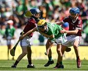 3 July 2022; Eoin Mangan, Abbeydorney NS, Kerry, representing Limerick, in action against Niall Kane, Scoil Éanna, Bullaun, Loughrea, Galway, representing Galway, left, and Ross Larkin, St Colmcille's NS, Knocklyon, Dublin, representing Galway, during the INTO Cumann na mBunscol GAA Respect Exhibition Go Games before the GAA Hurling All-Ireland Senior Championship Semi-Final match between Limerick and Galway at Croke Park in Dublin. Photo by Sam Barnes/Sportsfile