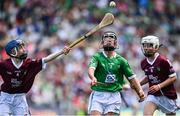 3 July 2022; Pádraig Hanley, Doon CBS, Doon, representing Limerick, in action against Niall Kane, Scoil Éanna, Bullaun, Loughrea, Galway, representing Galway, left, and Hugh McGinn, St Patrick's BNS, Carndonagh, Donegal, representing Galway, during the INTO Cumann na mBunscol GAA Respect Exhibition Go Games before the GAA Hurling All-Ireland Senior Championship Semi-Final match between Limerick and Galway at Croke Park in Dublin. Photo by Sam Barnes/Sportsfile