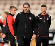 7 July 2022; Derry City manager Ruaidhrí Higgins with injured players Ciaron Harkin, left, and Michael Duffy, right, before the UEFA Europa Conference League 2022/23 First Qualifying Round First Leg match between Derry City and Riga at the Ryan McBride Brandywell Stadium in Derry. Photo by Stephen McCarthy/Sportsfile