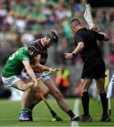 3 July 2022; Graeme Mulcahy of Limerick and Joseph Cooney of Galway contest possession near the sideline as linesman James Owens looks on during the GAA Hurling All-Ireland Senior Championship Semi-Final match between Limerick and Galway at Croke Park in Dublin. Photo by Piaras Ó Mídheach/Sportsfile