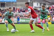 27 June 2022; Darragh Burns of St Patrick's Athletic in action against Andy Lyons, left, and Lee Grace of Shamrock Rovers during the SSE Airtricity League Premier Division match between St Patrick's Athletic and Shamrock Rovers at Richmond Park in Dublin. Photo by Piaras Ó Mídheach/Sportsfile