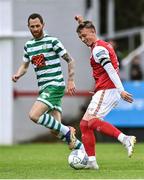 27 June 2022; Chris Forrester of St Patrick's Athletic shoots as Chris McCann of Shamrock Rovers closes in during the SSE Airtricity League Premier Division match between St Patrick's Athletic and Shamrock Rovers at Richmond Park in Dublin. Photo by Piaras Ó Mídheach/Sportsfile