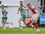 27 June 2022; Chris Forrester of St Patrick's Athletic shoots as Chris McCann of Shamrock Rovers closes in during the SSE Airtricity League Premier Division match between St Patrick's Athletic and Shamrock Rovers at Richmond Park in Dublin. Photo by Piaras Ó Mídheach/Sportsfile