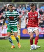 27 June 2022; Darragh Burns of St Patrick's Athletic in action against Lee Grace of Shamrock Rovers during the SSE Airtricity League Premier Division match between St Patrick's Athletic and Shamrock Rovers at Richmond Park in Dublin. Photo by Piaras Ó Mídheach/Sportsfile