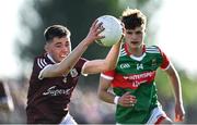 8 July 2022; Vinny Gill of Galway in action against Ronan Clarke of Mayo during the Electric Ireland GAA Football All-Ireland Minor Championship Final match between Galway and Mayo at Dr Hyde Park in Roscommon. Photo by Piaras Ó Mídheach/Sportsfile