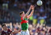 8 July 2022; Luke Feeney of Mayo in action against Ryan Flaherty of Galway during the Electric Ireland GAA Football All-Ireland Minor Championship Final match between Galway and Mayo at Dr Hyde Park in Roscommon. Photo by Piaras Ó Mídheach/Sportsfile
