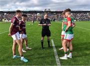 8 July 2022; Referee Niall Cullen with Galway joint-captains Jack Lonergan, left, and Éanna Monaghan and Mayo joint-captains Diarmuid Duffy and Ronan Clarke, right, before the Electric Ireland GAA Football All-Ireland Minor Championship Final match between Galway and Mayo at Dr Hyde Park in Roscommon. Photo by Piaras Ó Mídheach/Sportsfile
