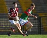 8 July 2022; Fionn of Connor of Galway in action against John McMonagle of Mayo during the Electric Ireland GAA Football All-Ireland Minor Championship Final match between Galway and Mayo at Dr Hyde Park in Roscommon. Photo by Piaras Ó Mídheach/Sportsfile