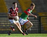 8 July 2022; Fionn of Connor of Galway in action against John McMonagle of Mayo during the Electric Ireland GAA Football All-Ireland Minor Championship Final match between Galway and Mayo at Dr Hyde Park in Roscommon. Photo by Piaras Ó Mídheach/Sportsfile