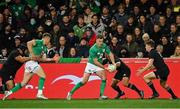 9 July 2022; Jonathan Sexton of Ireland attempts a pass to teammate Garry Ringrose, left, who is tackled by Ofa Tu'ungafasi of New Zealand, for which Ofa Tu'ungafasi was shown a yellow card, during the Steinlager Series match between New Zealand and Ireland at the Forsyth Barr Stadium in Dunedin, New Zealand. Photo by Brendan Moran/Sportsfile