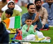 9 July 2022; Muslim worshipers, Milhaan, age six, and his dad Saad Ahmed, join Shaykh Dr Umar Al-Qadri as they offer Eid al-Adha prayers on the pitch in Croke Park during the celebration of Eid Al-Adha at Croke Park in Dublin. Photo by Ray McManus/Sportsfile