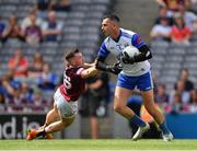 9 July 2022; Cavan goalkeeper Raymond Galligan prepares to clear, under pressure from Lorcan Dolan of Westmeath, during the Tailteann Cup Final match between Cavan and Westmeath at Croke Park in Dublin. Photo by Ray McManus/Sportsfile