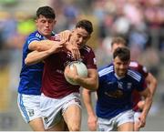 9 July 2022; Sam Duncan of Westmeath is tackled by James Smith of Cavan during the Tailteann Cup Final match between Cavan and Westmeath at Croke Park in Dublin. Photo by Stephen McCarthy/Sportsfile