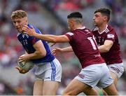 9 July 2022; Paddy Lynch of Cavan is tackled by Ronan O’Toole, 11, and Jack Smith of Westmeath during the Tailteann Cup Final match between Cavan and Westmeath at Croke Park in Dublin. Photo by Ray McManus/Sportsfile