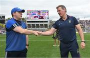 9 July 2022; Westmeath manager Jack Cooney, right, and Cavan manager Mickey Graham shake hands after the Tailteann Cup Final match between Cavan and Westmeath at Croke Park in Dublin. Photo by Seb Daly/Sportsfile