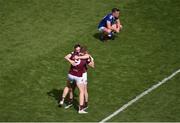 9 July 2022; Westmeath players, Ray Connellan, left, and James Dolan celebrate, while Gerard Smith of Cavan sits dejectedly on the field after the Tailteann Cup Final match between Cavan and Westmeath at Croke Park in Dublin. Photo by Daire Brennan/Sportsfile