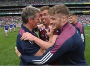 9 July 2022; Westmeath manager Jack Cooney, left, and Ger Egan, centre, celebrate after their side's victory in the Tailteann Cup Final match between Cavan and Westmeath at Croke Park in Dublin. Photo by Seb Daly/Sportsfile