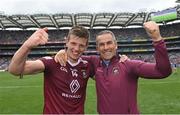 9 July 2022; John Heslin of Westmeath, left, and coach Dessie Dolan celebrate after their side's victory in the Tailteann Cup Final match between Cavan and Westmeath at Croke Park in Dublin. Photo by Seb Daly/Sportsfile