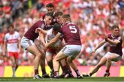 9 July 2022; Benny Heron of Derry in action against Galway players, from left, Matthew Tierney, John Daly and Dylan McHugh during the GAA Football All-Ireland Senior Championship Semi-Final match between Derry and Galway at Croke Park in Dublin. Photo by Seb Daly/Sportsfile