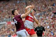 9 July 2022; Conor Doherty of Derry is tackled by Damien Comer of Galway during the GAA Football All-Ireland Senior Championship Semi-Final match between Derry and Galway at Croke Park in Dublin. Photo by Ramsey Cardy/Sportsfile