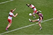 9 July 2022; Damien Comer of Galway scores his side's first point despite the challenge of Conor Glass, left, and Gareth McKinless of Derry during the GAA Football All-Ireland Senior Championship Semi-Final match between Derry and Galway at Croke Park in Dublin. Photo by Daire Brennan/Sportsfile
