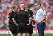 9 July 2022; Feargal McGill, GAA Director of Player, Club and Games, right, speaking with match officials, from left, Derek O'Mahoney, Brendan Cawley and Joe McQuillan, at the start of the second half of the GAA Football All-Ireland Senior Championship Semi-Final match between Derry and Galway at Croke Park in Dublin. Photo by Ramsey Cardy/Sportsfile