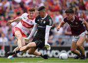 9 July 2022; Lachlan Murray of Derry shoots past Galway goalkeeper Connor Gleeson and full back Seán Kelly to score a goal, in the 74th minute,  during the GAA Football All-Ireland Senior Championship Semi-Final match between Derry and Galway at Croke Park in Dublin. Photo by Ray McManus/Sportsfile