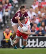 9 July 2022; Gareth McKinless of Derry is tackled by Cillian McDaid of Galway and was later shown a Yellow Card by referee Brendan Cawley during the GAA Football All-Ireland Senior Championship Semi-Final match between Derry and Galway at Croke Park in Dublin. Photo by Ray McManus/Sportsfile