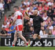 9 July 2022; Gareth McKinless of Derry is shown a Yellow Card by referee Brendan Cawley during the GAA Football All-Ireland Senior Championship Semi-Final match between Derry and Galway at Croke Park in Dublin. Photo by Ray McManus/Sportsfile