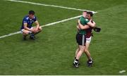 9 July 2022; Westmeath players Jason Daly, left, and Andy McCormack celebrate as James Smith of Cavan sits dejectedly on the field after the Tailteann Cup Final match between Cavan and Westmeath at Croke Park in Dublin. Photo by Daire Brennan/Sportsfile