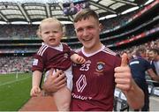 9 July 2022; Conor Dillon of Westmeath with his daughter Amelia, age 18 months, after his side's victory in the Tailteann Cup Final match between Cavan and Westmeath at Croke Park in Dublin. Photo by Seb Daly/Sportsfile