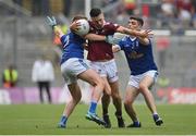 9 July 2022; Ronan O’Toole of Westmeath in action against Jason McLoughlin, left, and Stephen Smith of Cavan during the Tailteann Cup Final match between Cavan and Westmeath at Croke Park in Dublin. Photo by Seb Daly/Sportsfile
