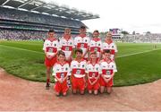 9 July 2022; The Derry team, back row, left to right, Tomás O’Kane, New Row P.S., Castledawson, Derry, Fionn Brady, Scoil Mhuire, Magherarney, Smithborough, Monaghan, Ruairí Smith, Killygarry N.S., Killygarry, Cavan, Pádraig Donaghy, Blessed Patrick O'Loughran P.S., Castlecaulfield, Dungannon, Tyrone, Fionn Rea, Primate Dixon Coalisland, Coalisland, Tyrone, front row, left to right, Tiarnan Mc Kenna, St Canice P.S., Dungiven, Derry, Ken Irwin, Saint Lorcan's Boy's N.S., Palmerstown, Dublin, Nathan Duffy, Lisdoonan N.S., Carrickmacross, Monaghan, and Thomas Slowey, St Mary's P.S., Newtownbutler, Fermanagh, the INTO Cumann na mBunscol GAA Respect Exhibition Go Games before the GAA Football All-Ireland Senior Championship Semi-Final match between Galway and Derry at Croke Park in Dublin. Photo by Daire Brennan/Sportsfile