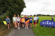 10 July 2022; parkrun Ireland, in partnership with Vhi, expanded their range of junior events to 30 with the introduction of the St Fergal’s Junior parkrun in Rathdowney, Laois on Sunday morning. Junior parkruns are 2km long and cater for 4 to 14-year olds, free of charge providing a fun and safe environment for children to enjoy exercise. To register for a parkrun near you visit www.parkrun.ie. Pictured are race director Shane Keegan and participants during a parkrun in Rathdowney, Laois. Photo by Michael P Ryan/Sportsfile